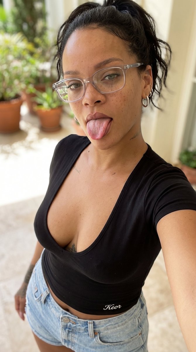 Glamorous Close-up Selfie of Woman Playfully Sticking Tongue Out