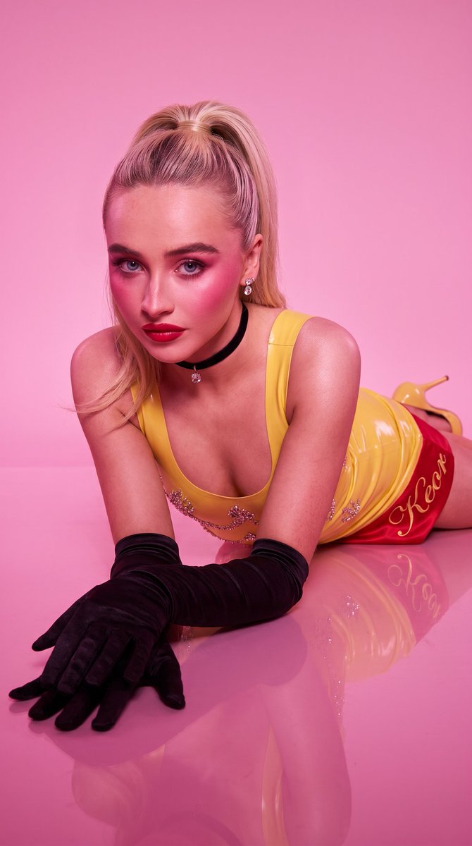 Glamorous Platinum Blonde in Hot Pink Latex Mini Dress