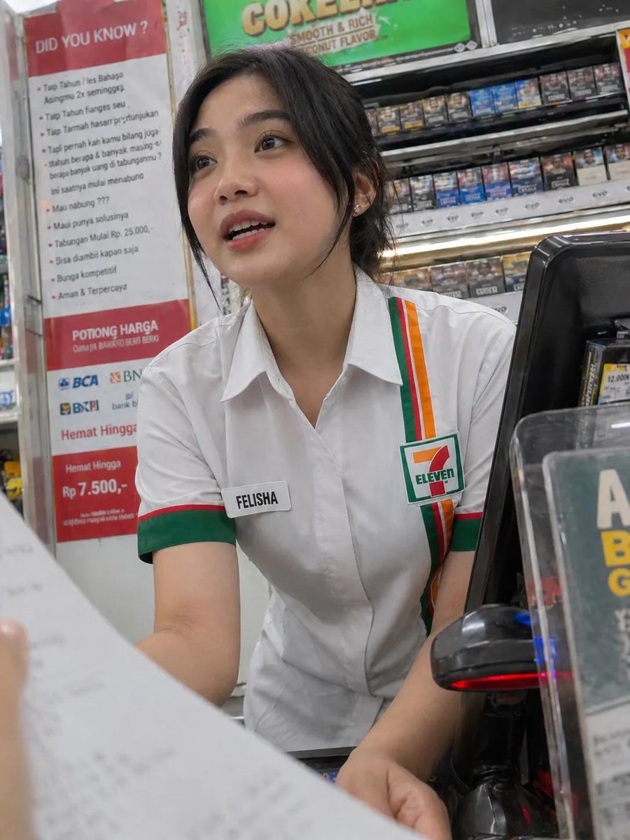Candid Photo of an Indonesian Convenience Store Cashier